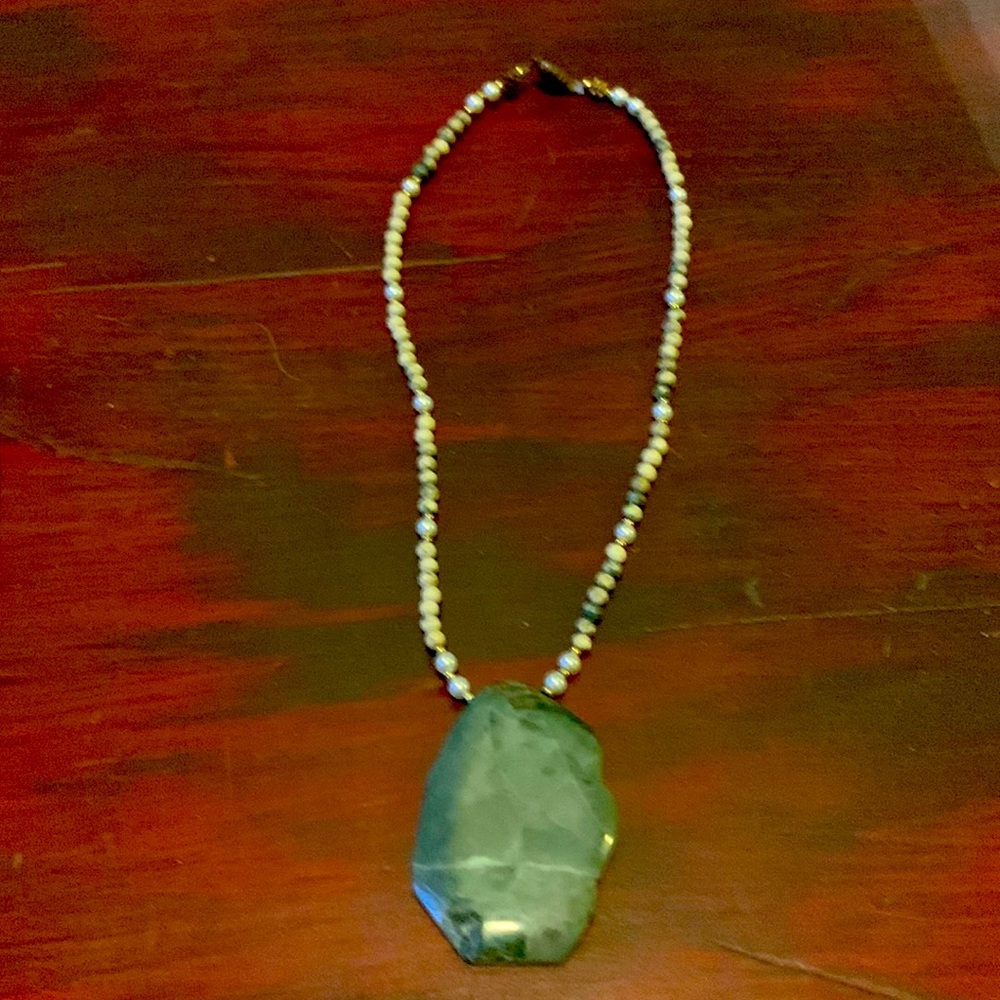 Green bead necklace with polished green stone